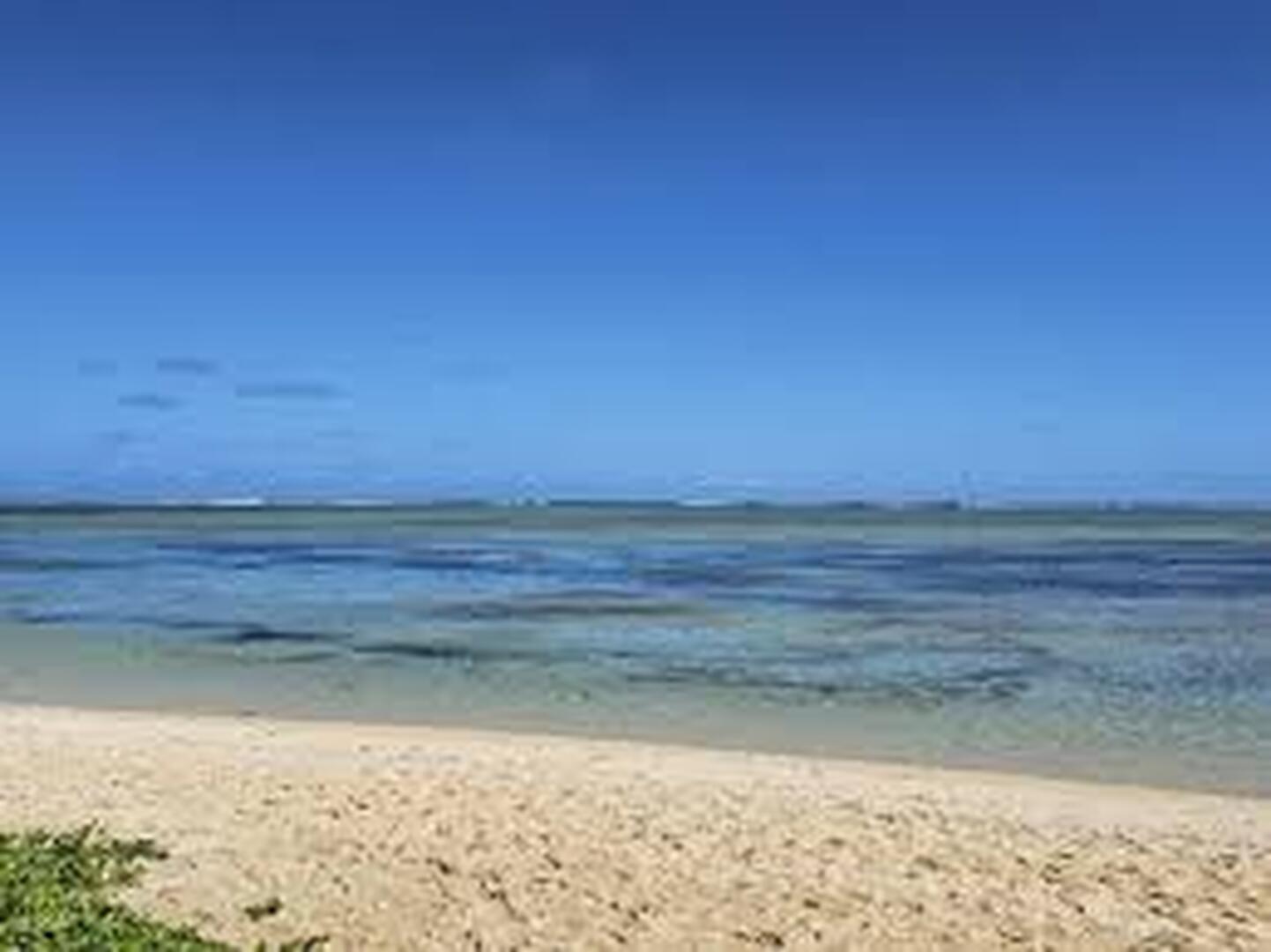 Investissez dans un Terrain Front de Mer de 60 Perches à Riambel – Propriété en Bord de Plage de Sable Blanc à Vendre