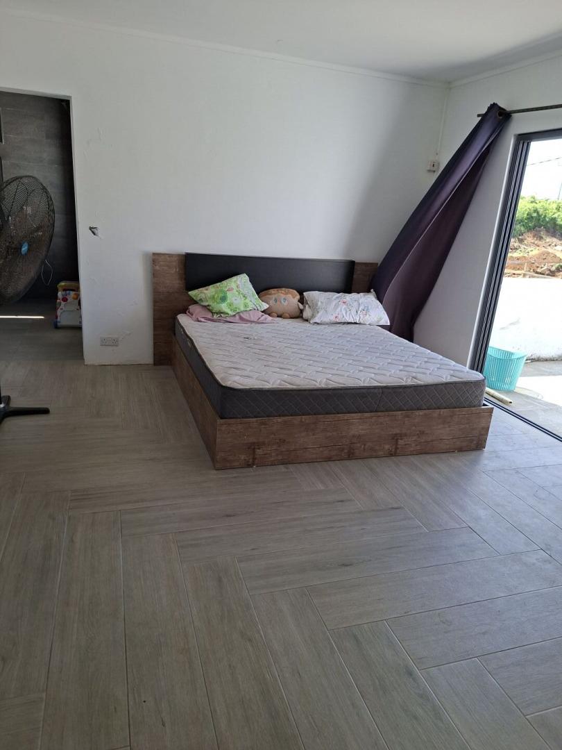 Maison à vendre à Calodyne – Propriété spacieuse de 3 chambres avec fort potentiel